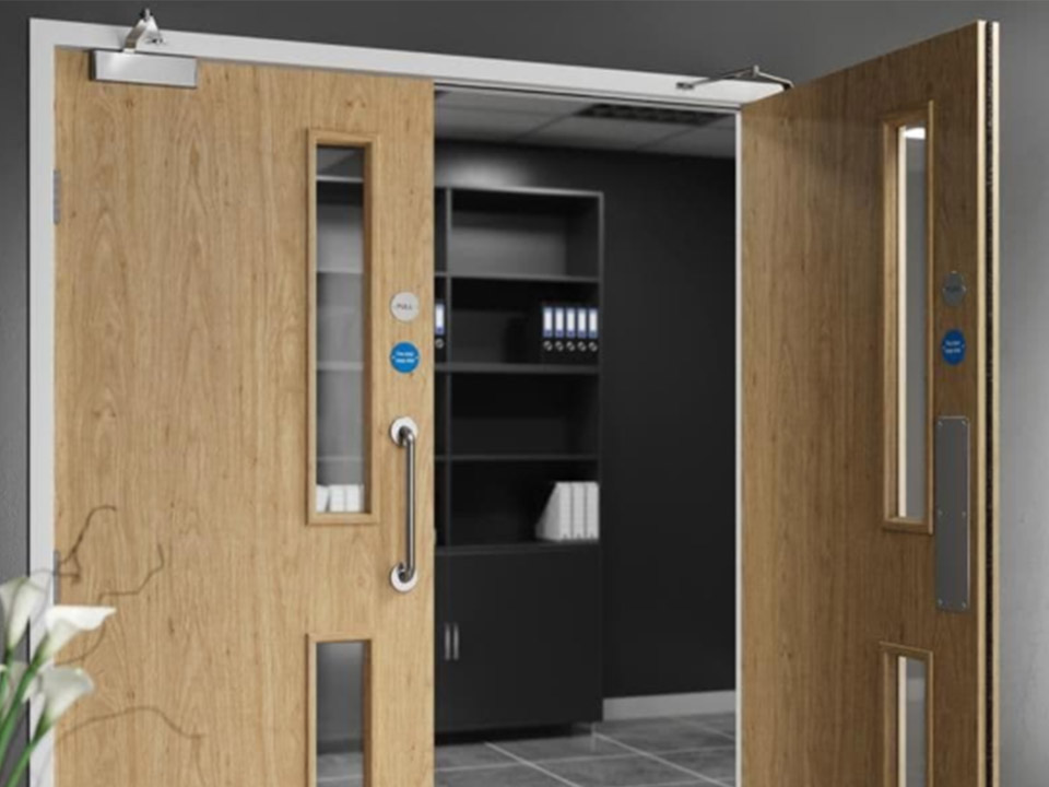 Accessible wooden doors with vision panels.